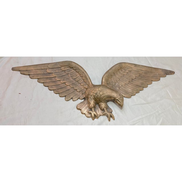 Up for sale is a very heavy vintage bronze wall mount American bald eagle. Crafted from solid bronze, this statue portrays...