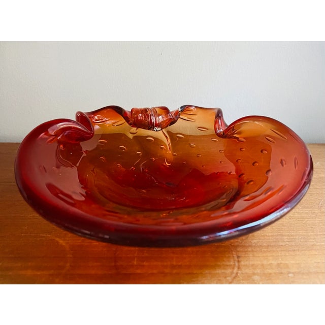 Lush thick Murano style glass ashtray / trinket tray in a vermillion tone. Ornate detailing, clean without chips or...