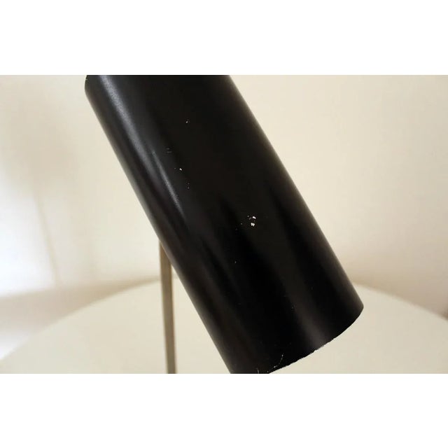 - Cast iron base - Nickeled stem - Black lacquered reflector in tubular shape - Multi-adjustable I have official proof of...