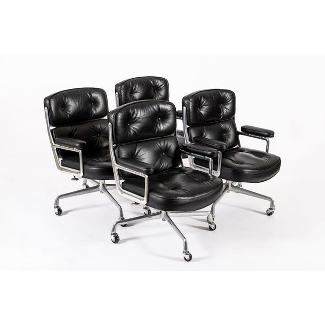 These vintage mid century modern black Model 3475 Eames Time Life Lobby Chairs designed by Charles & Ray Eames for Herman...