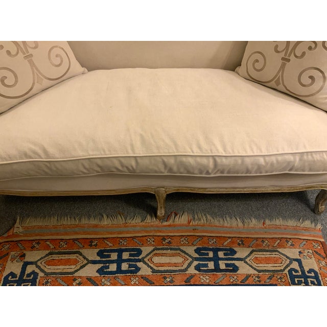 2015 contemporary French country style setee. White washed wood accent and nicely upholstered fabric. Down seat cushion...