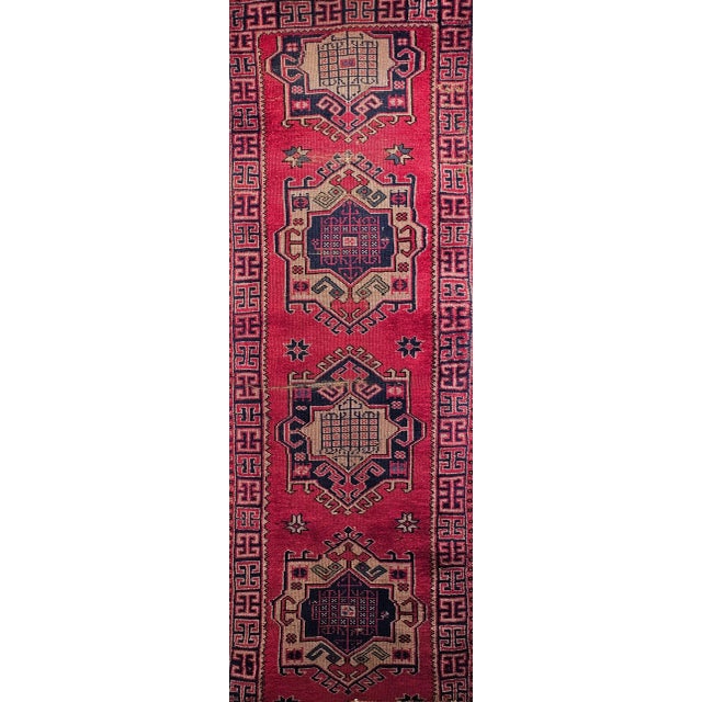 2’ 6” x 6’ 7” A Turkish village runner in a geometric medallion design similar to the Persian Heriz Karajeh runners. The...
