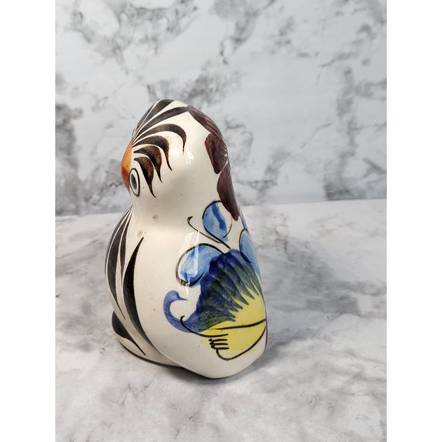 Vintage hand painted ceramic owl with floral motif on backside. Signed by artist. Minor age wear. No chips or cracks.