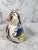 Vintage hand painted ceramic owl with floral motif on backside. Signed by artist. Minor age wear. No chips or cracks.