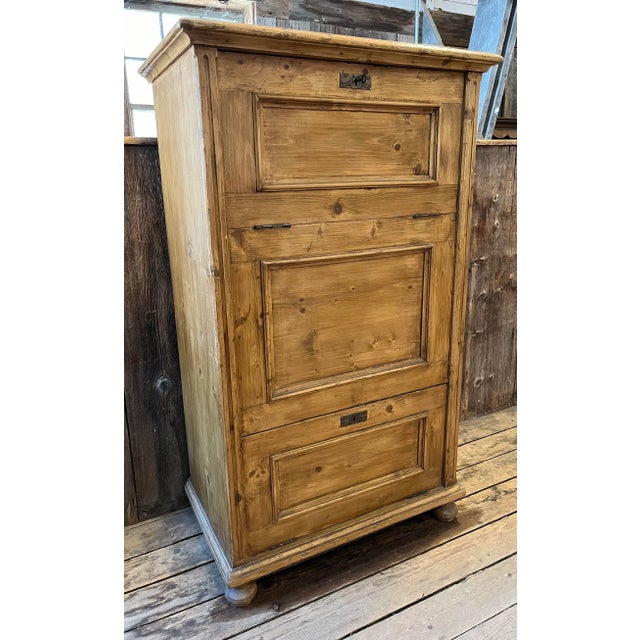 Antique pine pantry cupboard with nice molded panel doors. There are two very unusual drop front doors. Circa 1880. The...