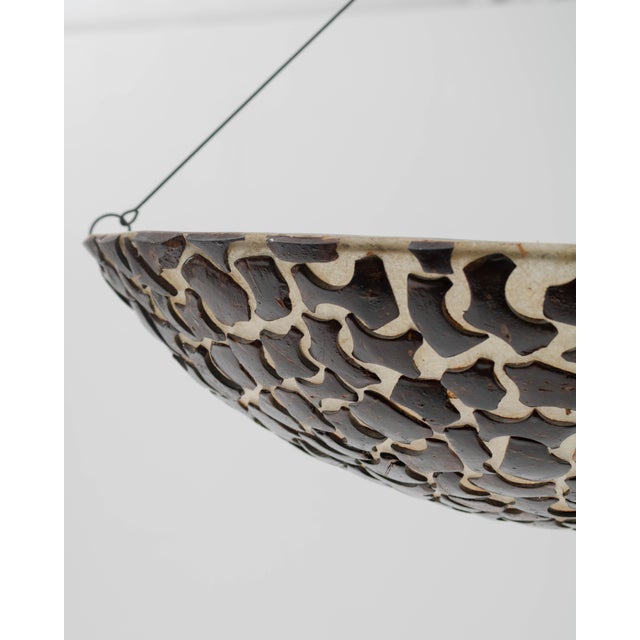 A floor lamp with an organic and sculptural design, created in the mid-20th century. It stands out for its elegant metal...