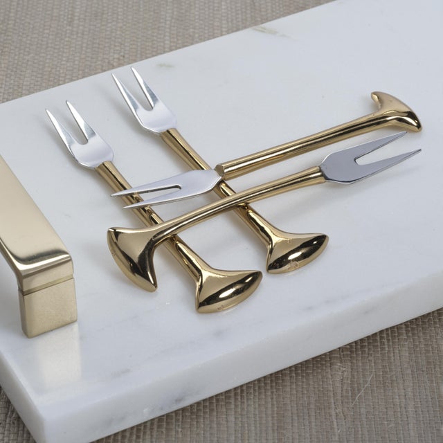 A refined addition to any cocktail or cheese board presentation, this set of four stainless steel and brass forks features...