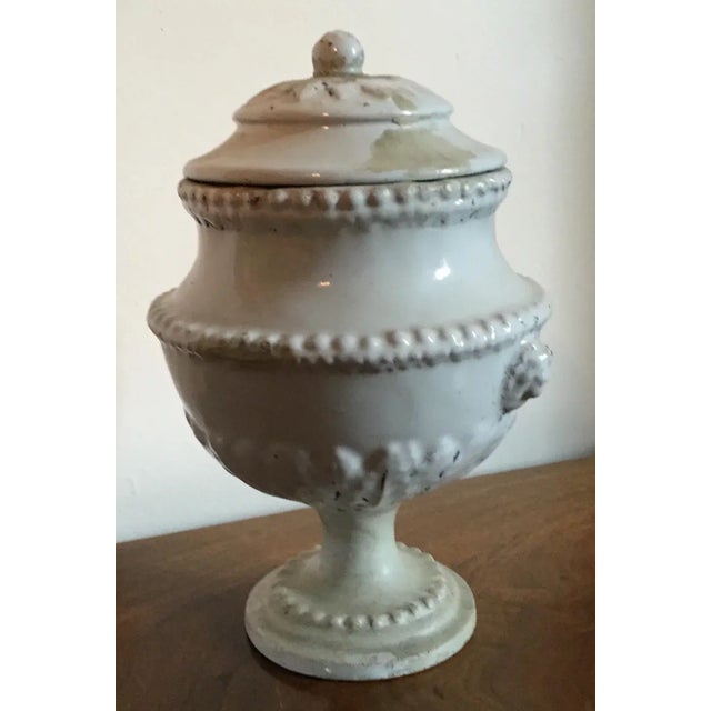 Antique 18th c. Italian tin glaze faience pottery urn with cover. Lion mask handles to each side, berry knop to the lid....