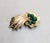 1961 goldtone oval cabochon faux-jade with small round clear rhinestone accents comment brooch with security clasp. Marked...