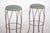 Pair of tall metal stools. Ideal for bar, kitchen or counter environments, they have an elegant, slender design. With four...