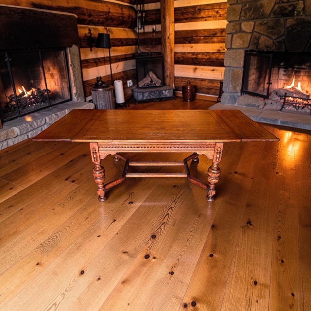Bring historic European grandeur to your dining room with this exceptional early 20th-century Jacobean style draw-leaf...