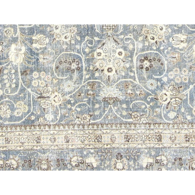 This lavish hand-knotted 1940s Persian Tabriz rug adds the perfect touch of elegance to any space. Its intricate design...