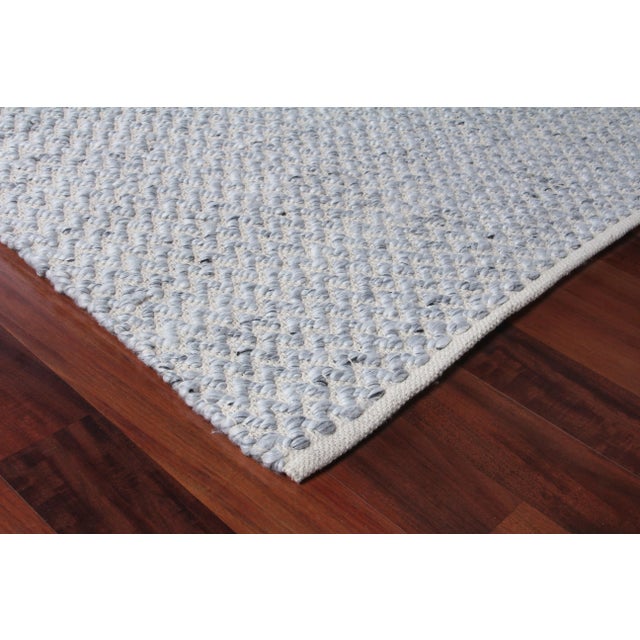 Subtle simplicity was key in creating the sleek and classic design of the Witten rug. Beautifully handwoven with a unique...