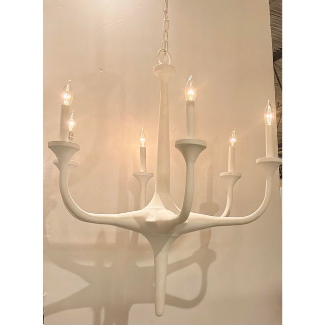 Original retail $2490, stylish Currey & Company Modern White Wrought Iron Albion Chandelier, showroom floor sample