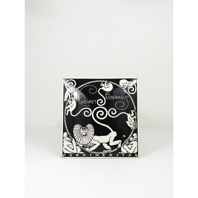 A domed, black & white enameled Art Nouveau advertising sign for Cabaret Fledermaus in Vienna. Artwork by Moriz Jung from...
