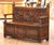 This handsome antique hall bench combines strong Gothic Revival architecture with practical concealed storage. Crafted in...