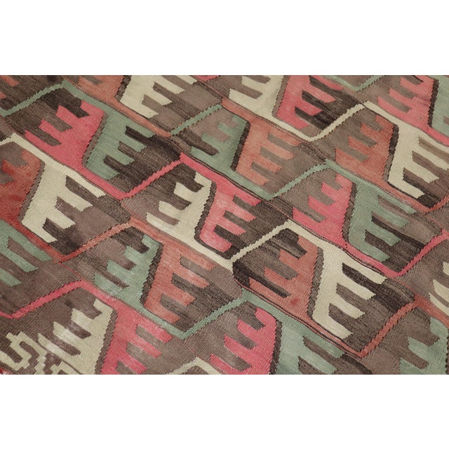 One of a kind, hand knotted Turkish tribal Kilim flat-weave from the second quarter of the 20th century with a rustic all-...