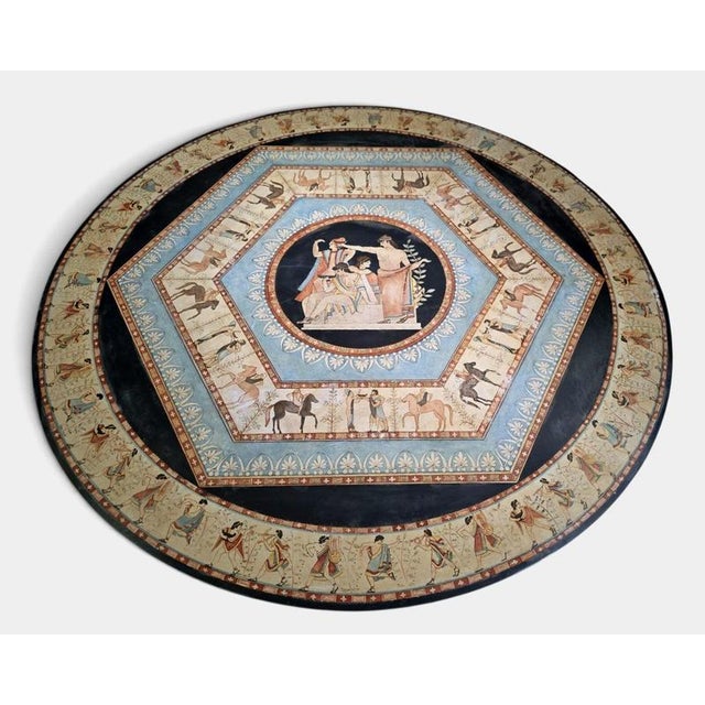 An extraordinary and highly decorative Italian round marble table dating from the early 20th century, featuring a...