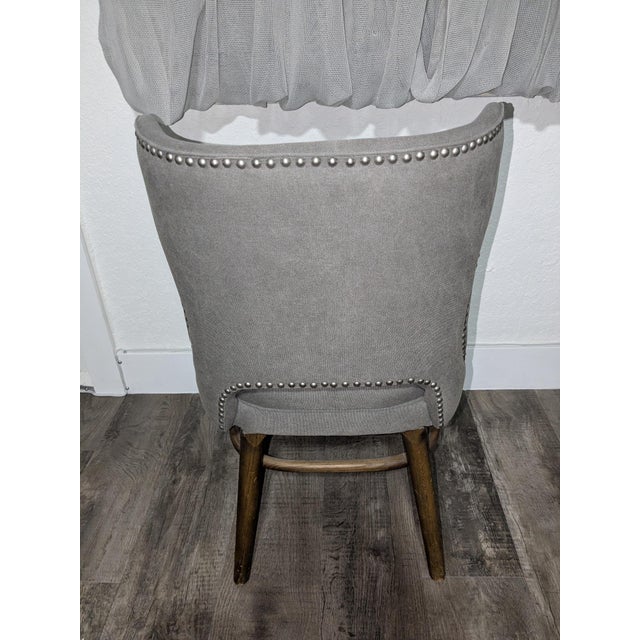 Beautiful set of four Four Hands upholstered dining chairs featuring elegant curved backs, decorative silver nailhead...