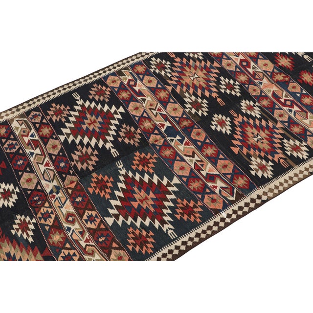 This vintage 6x11Persian kilim is believed to be a Shahsavan tribal rug—handwoven in wool circa 1950-1960. On the Design:...