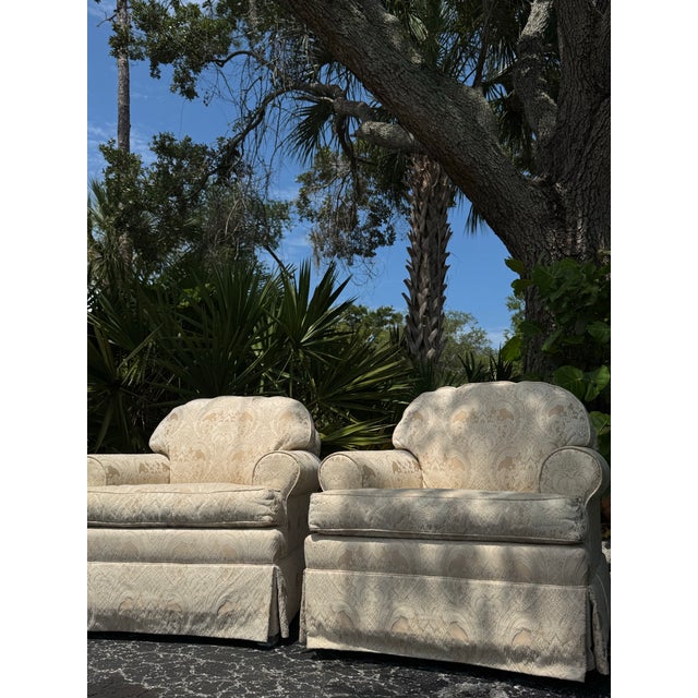 A beautiful pair of vintage Ethan Allen accent chairs featuring elegant white damask upholstery and timeless traditional...