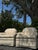 A beautiful pair of vintage Ethan Allen accent chairs featuring elegant white damask upholstery and timeless traditional...