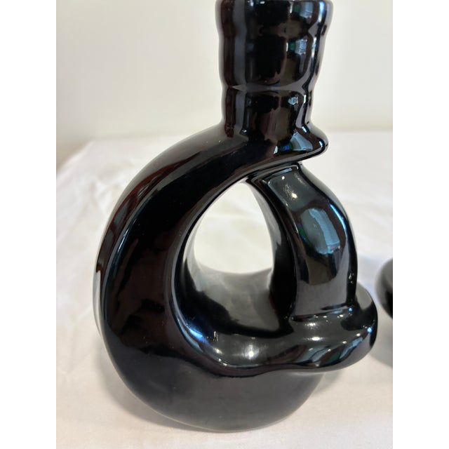 Full Description: Sleek pair of vintage Frankoma black glazed ceramic vases with distinctive looped organic form. The...
