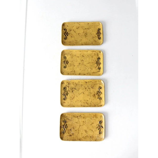 This is a set of four vintage Fitz & Floyd paper mache plates. The goldenrod rectangular trays feature olive green finial...