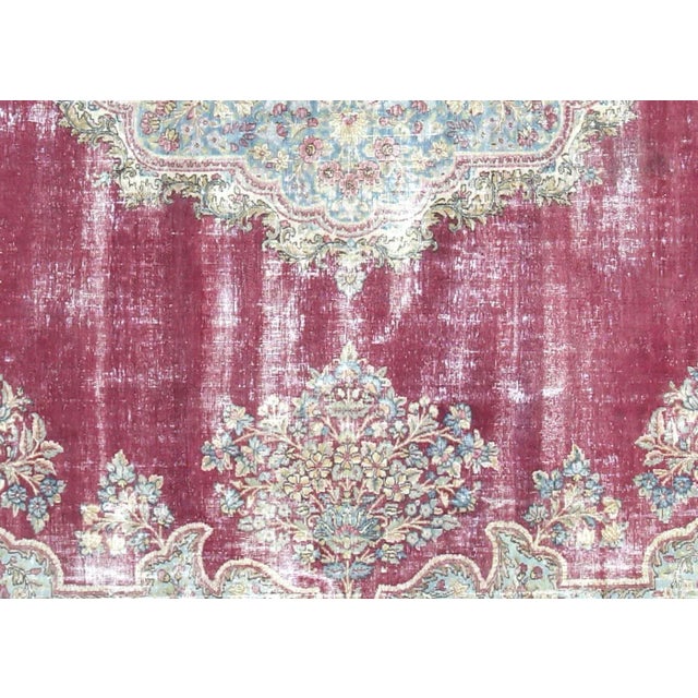 1950s Persian Kerman Carpet. Hand woven in the Kerman region of Iran. Distressed and refinished in the U.S. The Persian...