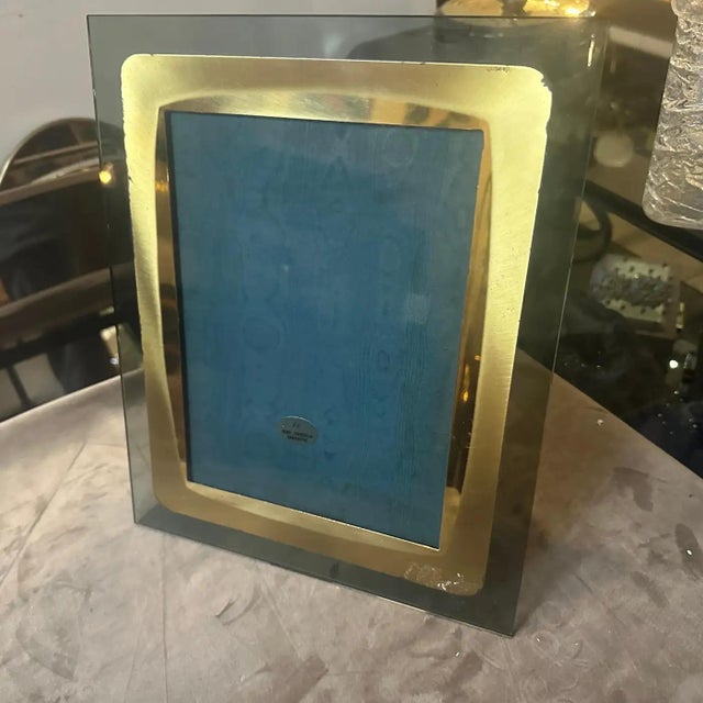 This high-quality 1960s Italian picture frame is a sophisticated example of mid-century modern design, blending industrial...