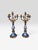 Elegant matched pair of French five-light candelabra featuring richly colored cobalt-blue porcelain bodies decorated with...