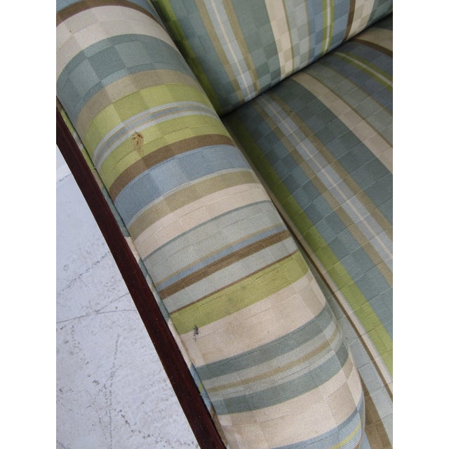 This stunning vintage modern sofa boasts a rich rosewood back and sculpted sides. Six flat bar chrome legs and overstuffed...