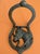 This cast iron door knocker features a sculpted horse head within a horseshoe knocker. It brings a bit of equestrian charm...
