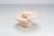 Magnussen Ponte coffee table in Mactan stone, Belgium, 1970. A striking sculptural design crafted from pale pink Mactan...