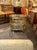 The Vintage French Gilt Brass Bar Cart is a luxurious addition to any home. This stylish piece of furniture features a...