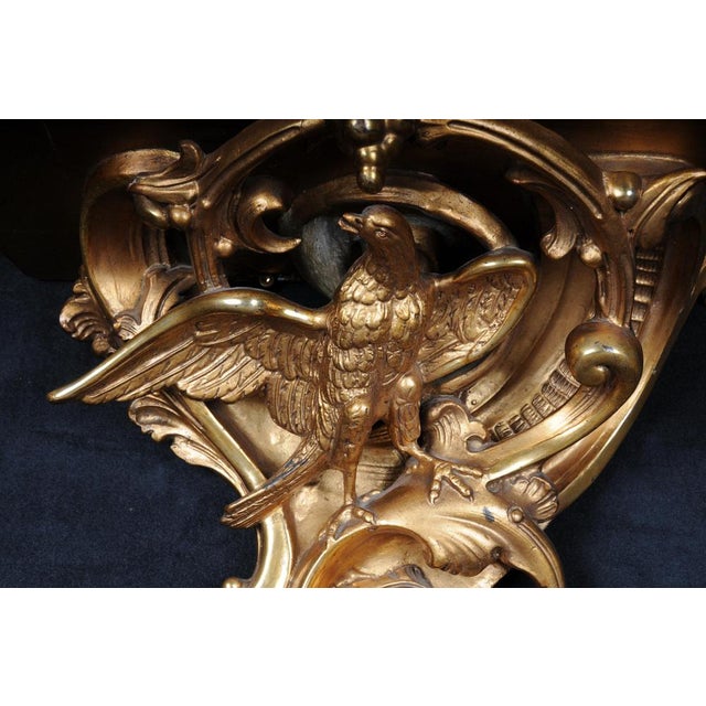 Magnificent Rococo wall console with eagle, gilded. Wood/stucco, gilded. Matching filing on rocaille eagle sculpture....