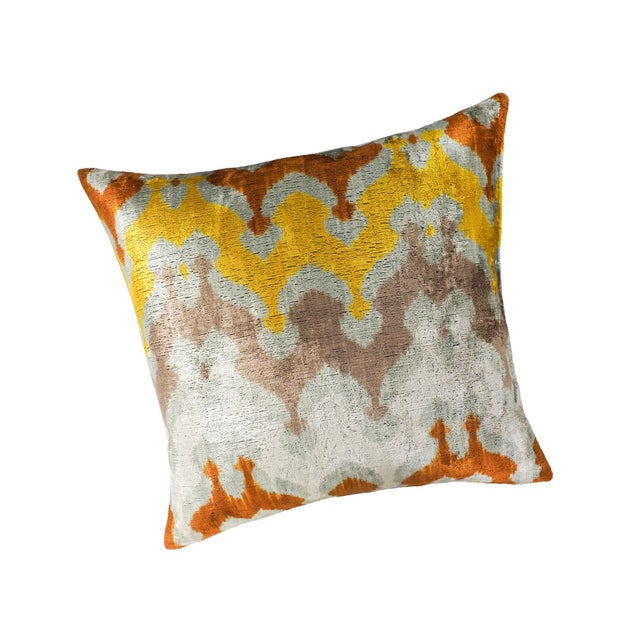 The River Silk Velvet Ikat Pillow Cover channels natural flow and ancient artistry through a rich medley of mustard,...
