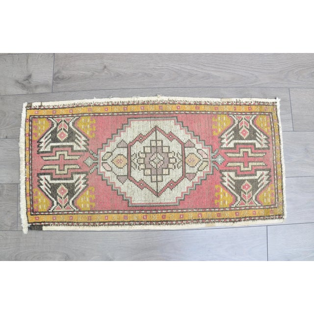This is a vintage Turkish Oushak rug from the 1960s. The piece was hand-knotted.