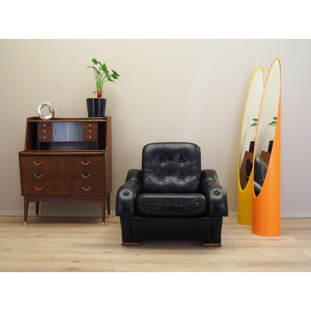 The armchair was made in the 1980s, Italian manufacture. Legs made of solid wood. The armchair is covered with original,...