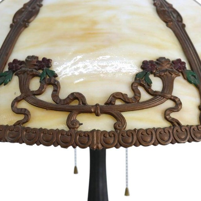 An antique Arts & Crafts table lamp attributed to Bradley & Hubbard, dating to approximately 1920. This distinctive...