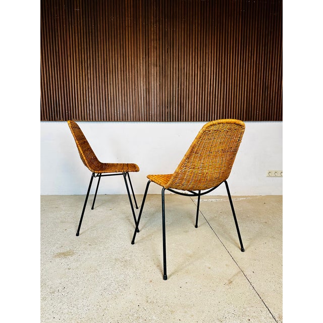 A pair of high-quality, stackable wicker chairs by the Italian-Swiss designer and architect Gian Franco Legler, featuring...