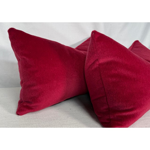 Custom pair of 12"x22" pillows covered in Brunschwig & Fils "Autun Mohair" in berry. These pillows are knife edged, serged...