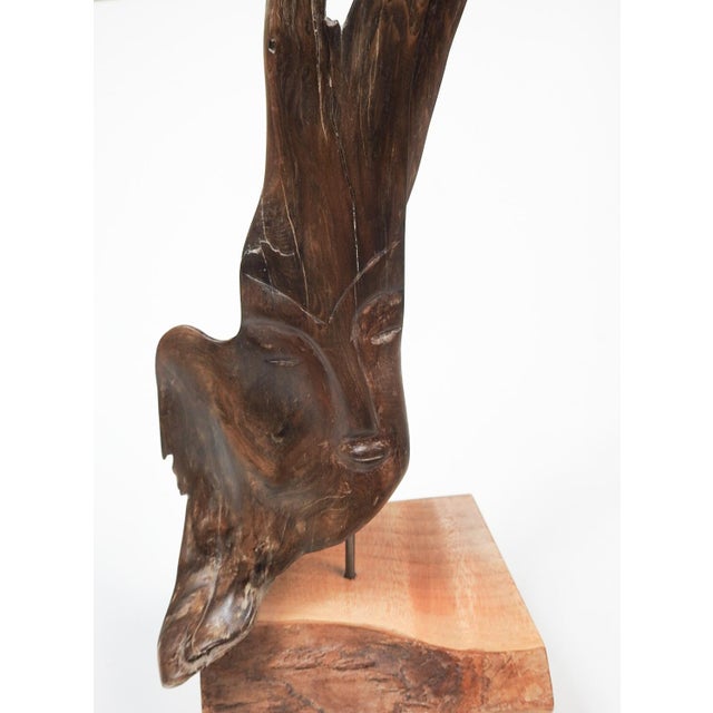 2017 hand carved face sculpture out of dark found wood. Mounted on block of maple, signed with monogram and dated on bottom.