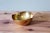 This brass bowl or trinket dish embodies the timeless elegance of classic decorative accessories. Its organic shape,...