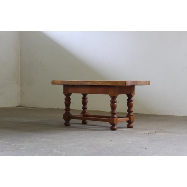 A 19th-century Jacobean refectory style coffee table, crafted in the Danish farmhouse style, featuring a thick, solid oak...