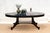 A magnificent antique French oval dining table, a true testament to enduring design beautifully updated for contemporary...