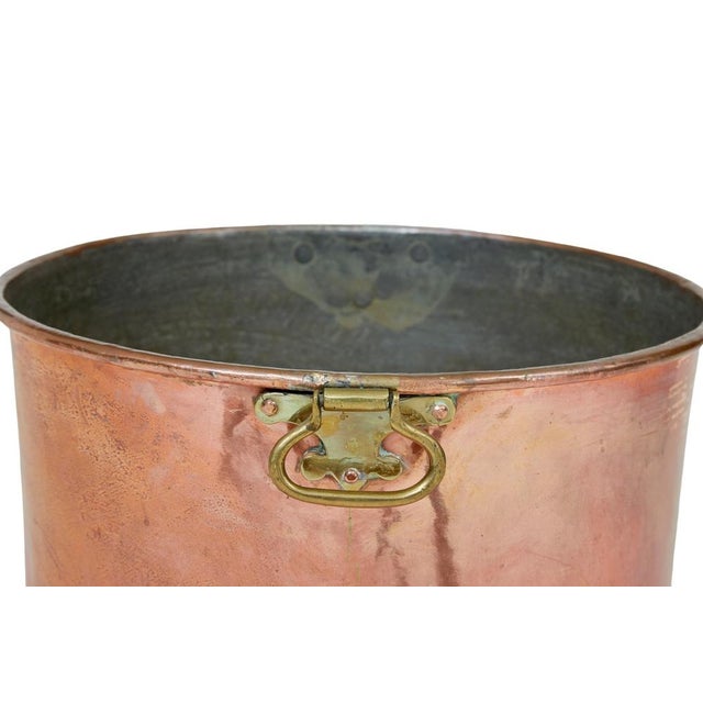 19th century copper and brass shaped bucket circa 1890. Ideal for use as a bin or a fireside log bin. Shaped like an...