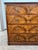 A handsome antique commode veneered in richly figured burr walnut, featuring four graduated drawers, molded edges, and...