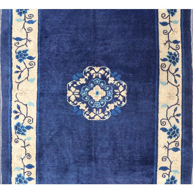 Measures: 4' x 6'8. Antique Chinese Peking Carpet in Dark Blue Background S12-0510, 1900’s Antique Chinese Peking Rug- The...