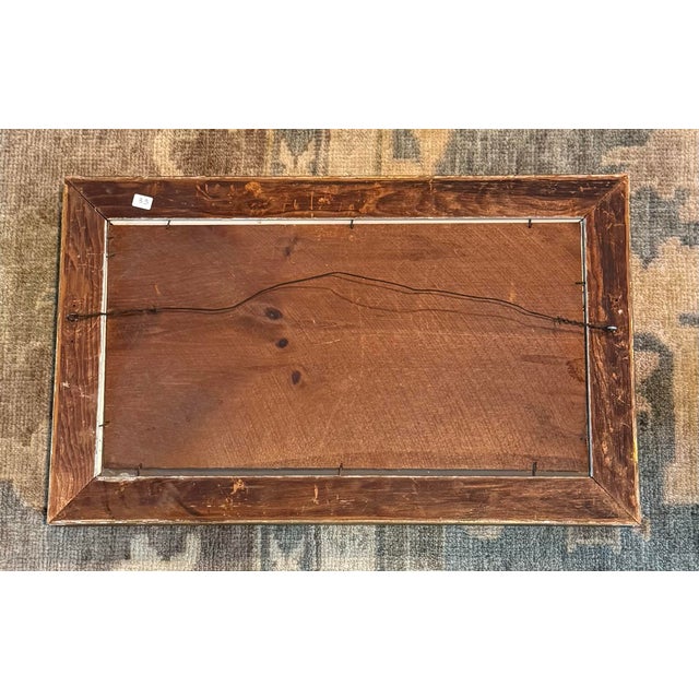 A quietly luminous American wilderness landscape — a still lake flanked by dense conifers, two birds skimming the glassy...